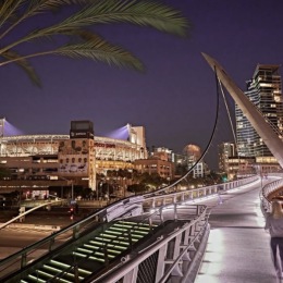 view of a bridge near a city at night